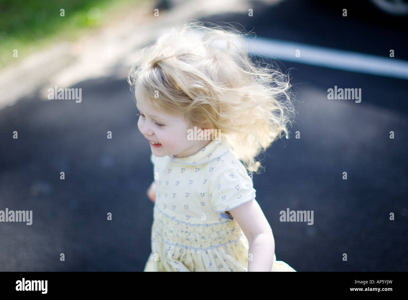 ©David Howells 2007 Tel +1 305 778 1846  Blonde haired two year old running. Stock Photo
