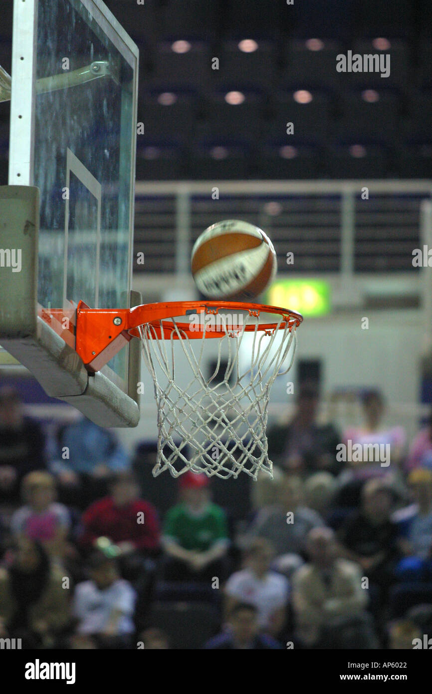 Basketball scoring in hoop Stock Photo Alamy