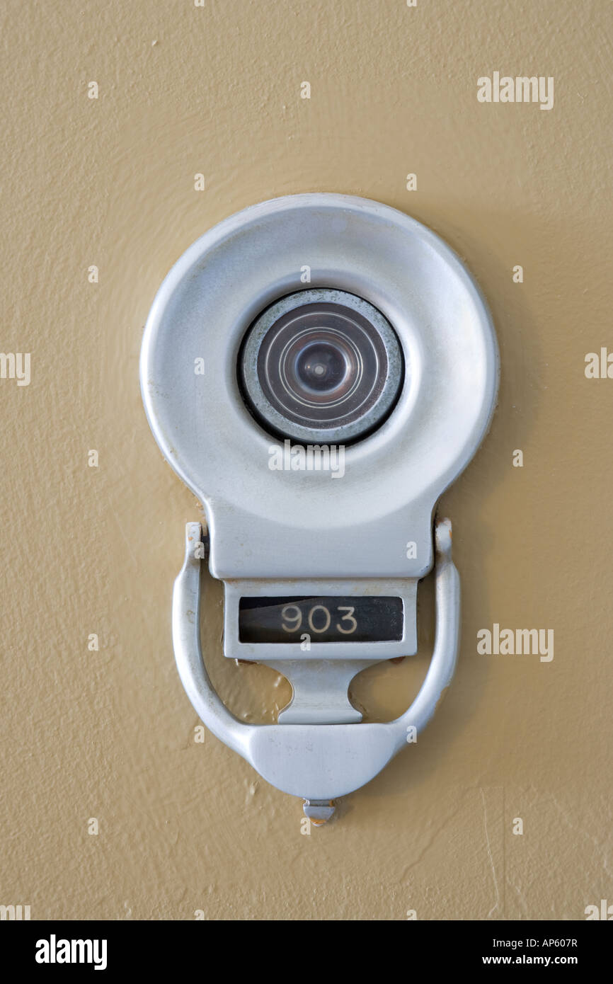 US door knocker with viewer and apartment unit number Stock Photo