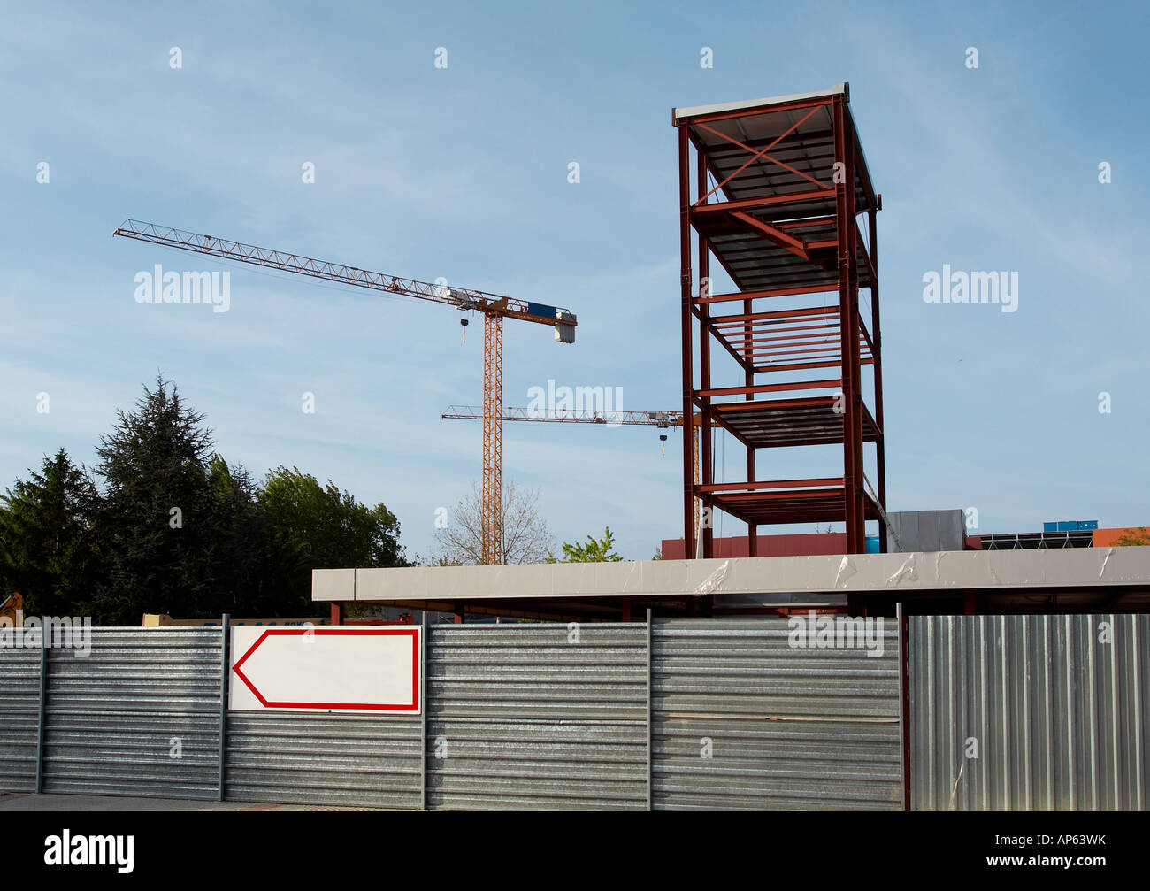 Steel Structure and Construction crane set against a blue sky Stock Photo