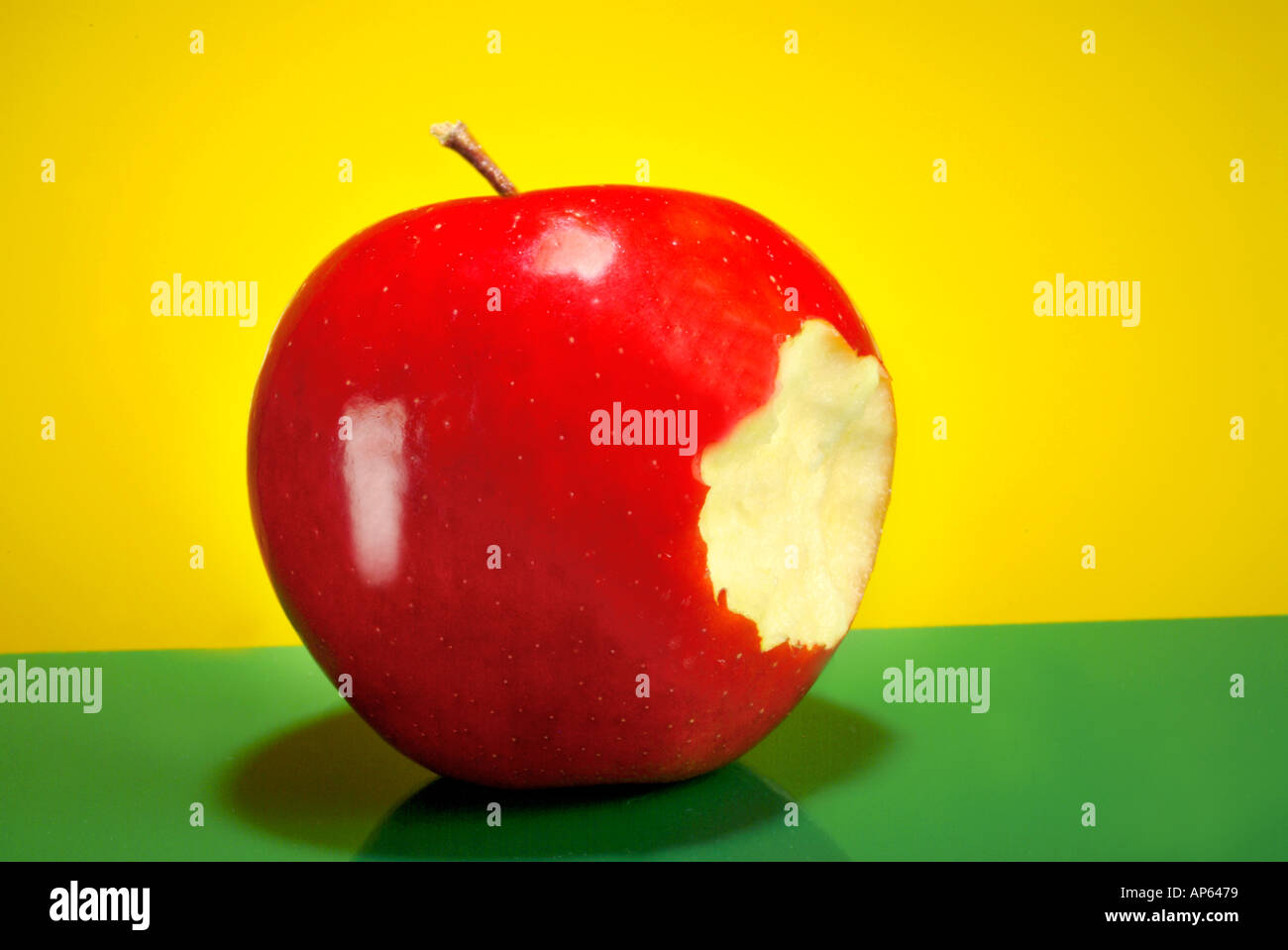 shiny red delicious apple with bite out of it Stock Photo Alamy