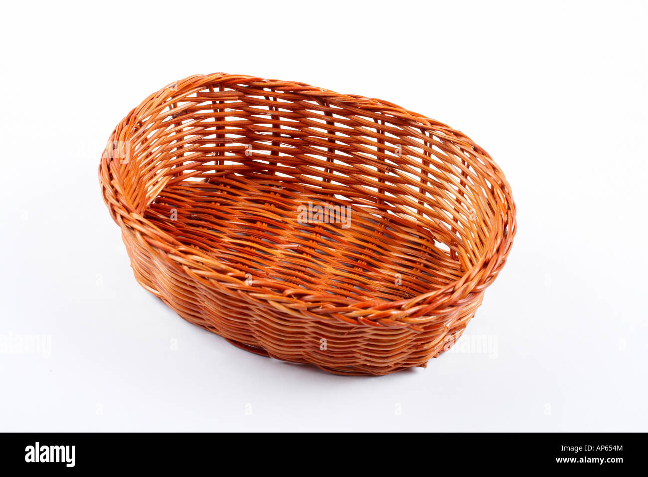 Empty wicker basket on white background Stock Photo - Alamy