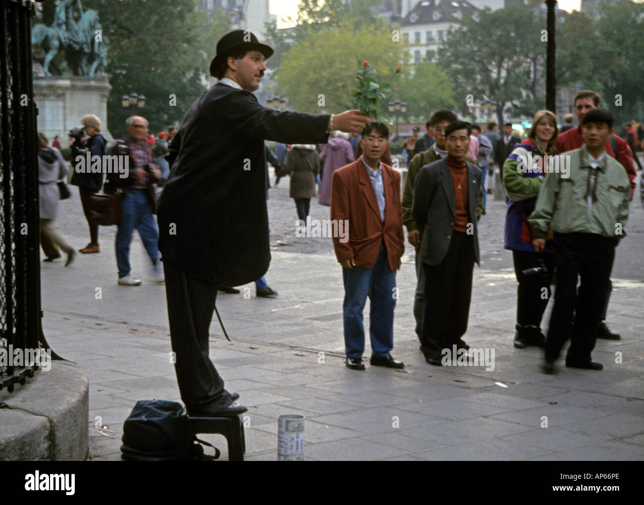 Paris, street performance actor pretending to be Charle Chaplin Stock ...