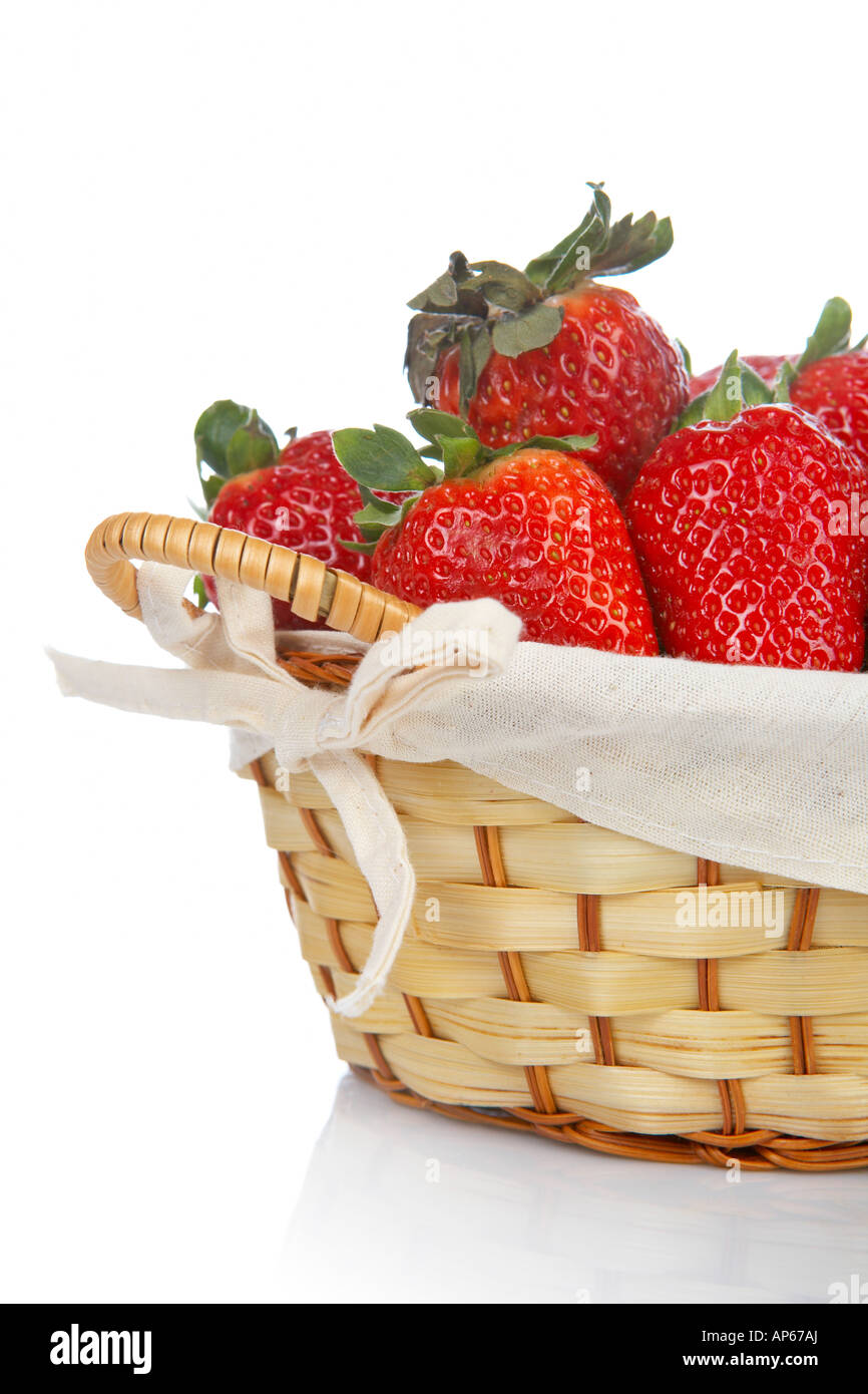Basket of strawberries reflected on white background Stock Photo - Alamy