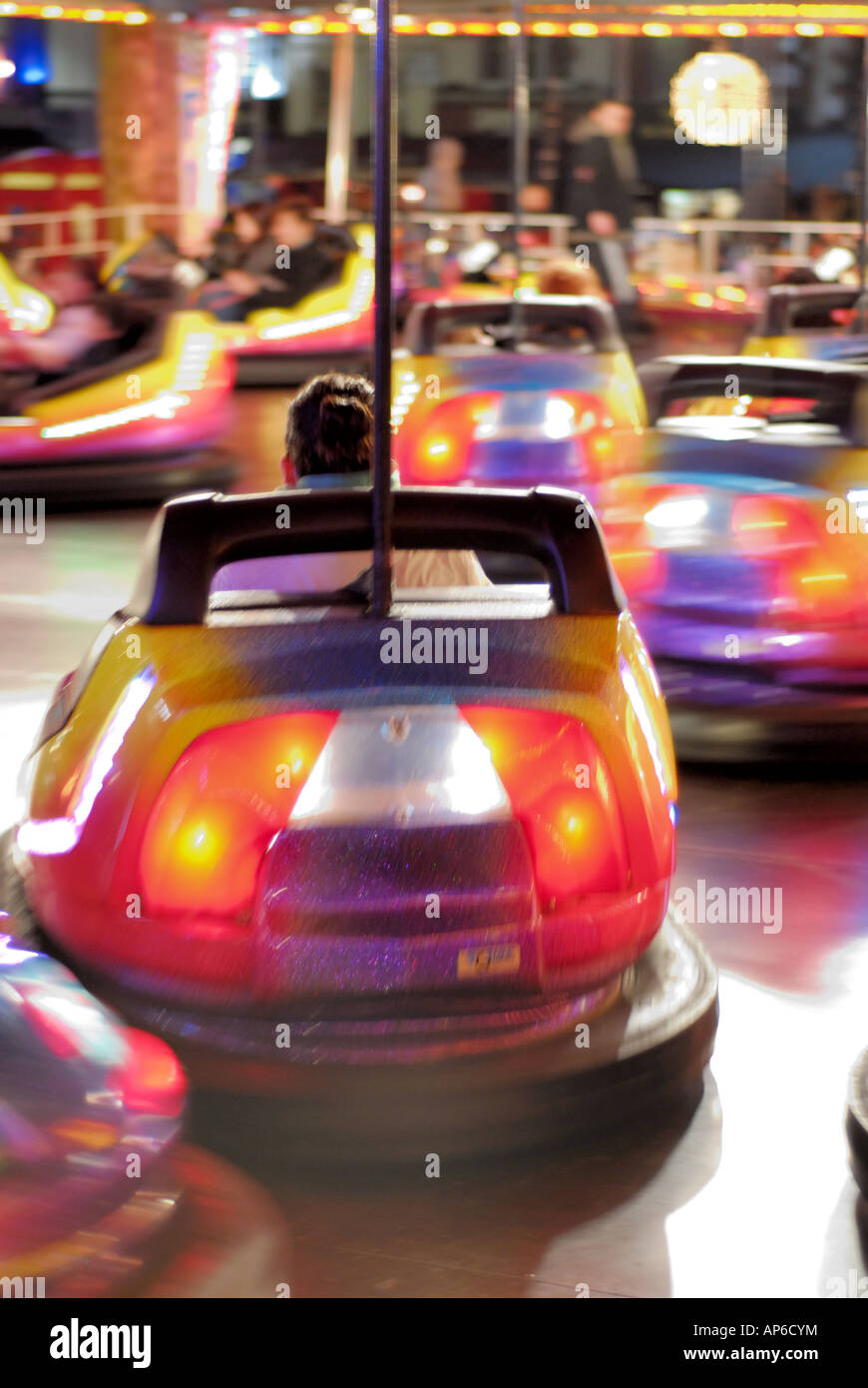 Children taking a bumper car ride at Leicester Square fun fair London