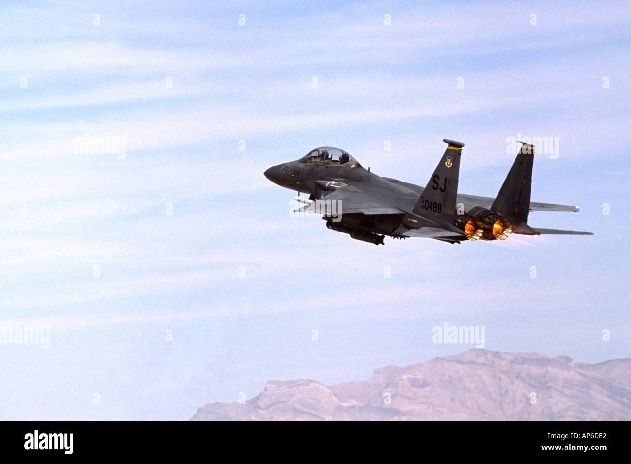 A USAF F 15E Strike Eagle attack fighter departs Nellis Air Force Base on a Red Flag mission Stock Photo