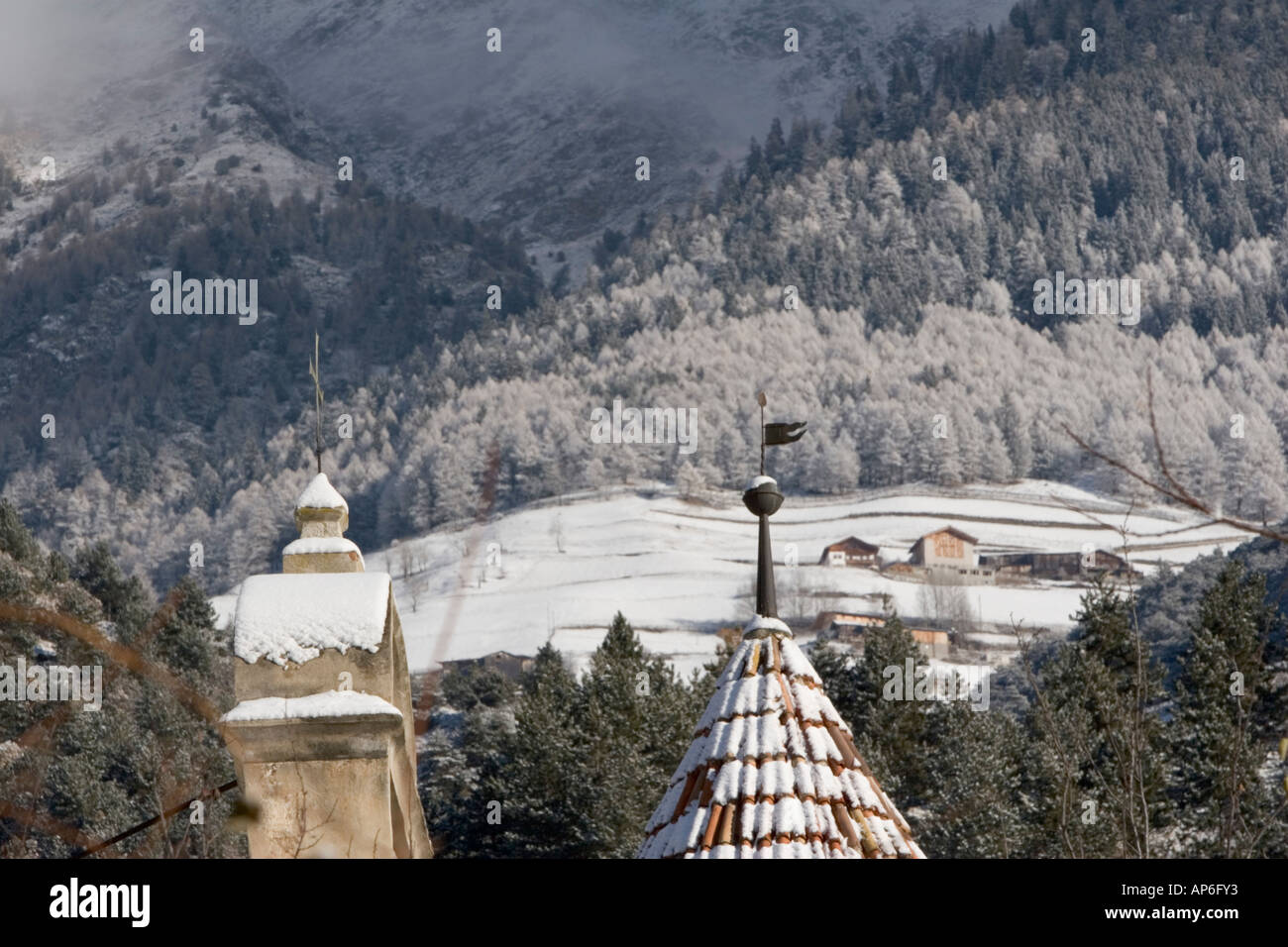 Weathervane and chapel cross of Castle Goldrain in winter, South Tyrol, Italy Stock Photo