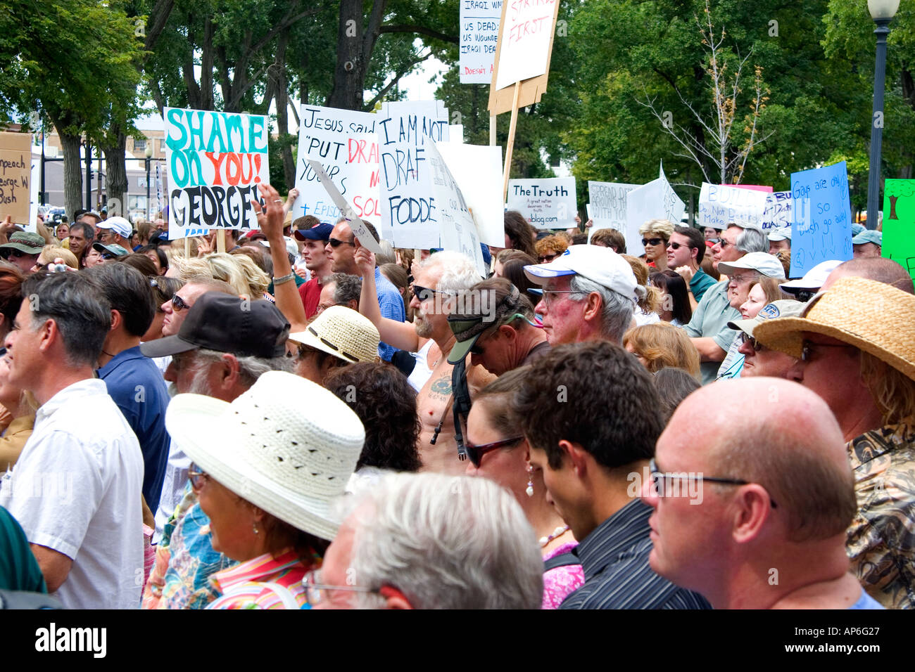 A crowd holding signs at an Anti war protest in Salt Lake City Utah 8 22 2005 Stock Photo