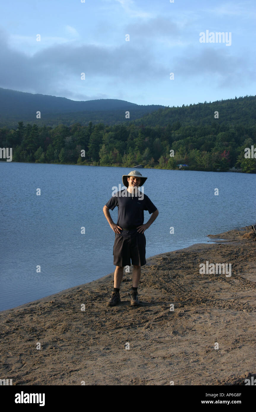 Man standing at North South Lake in the Catskill Mountains New York State Stock Photo