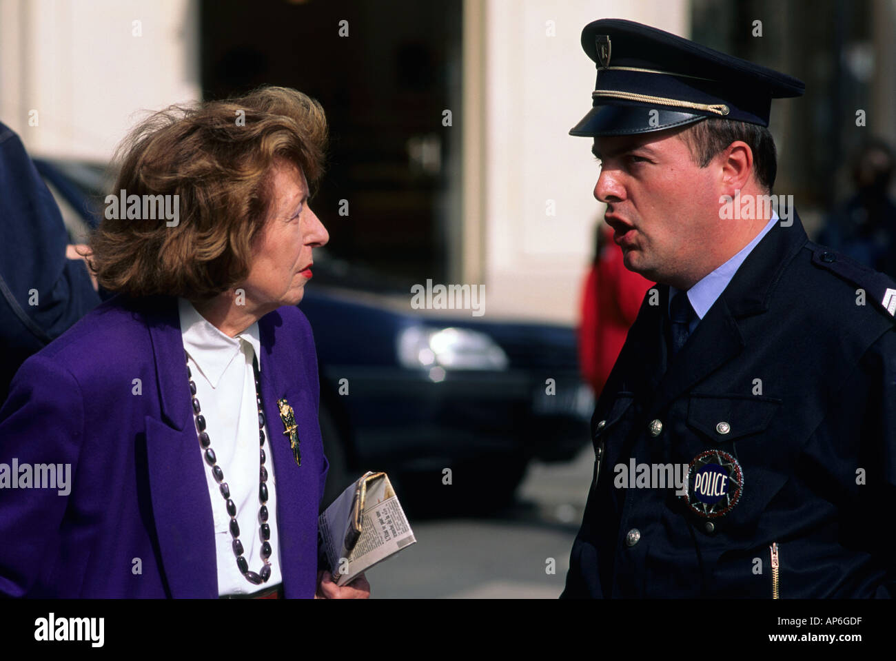 Police officer talks woman in hi-res stock photography and images - Alamy