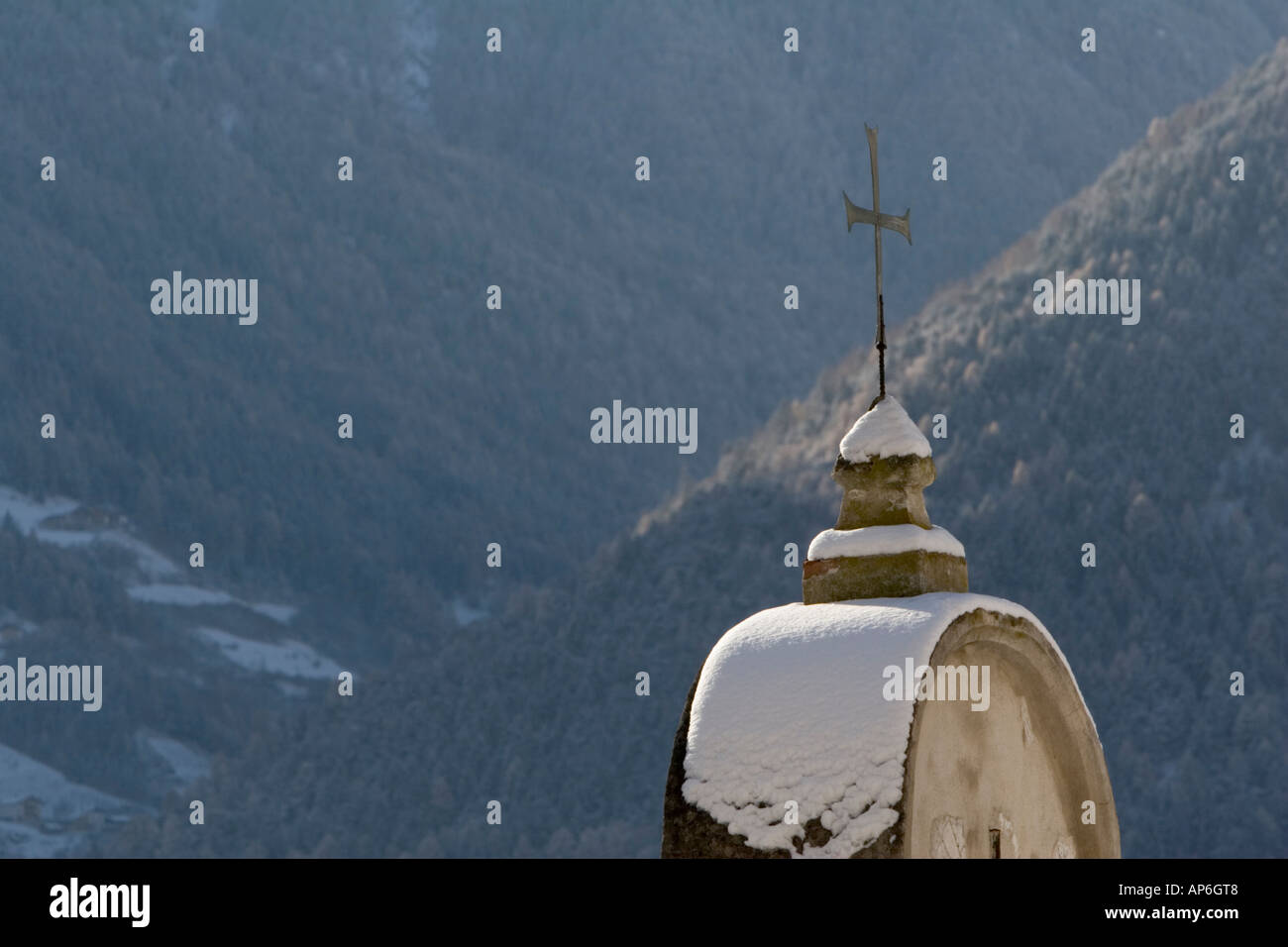 Church cross of Goldrain castle in winter, South Tyrol Italy Stock Photo