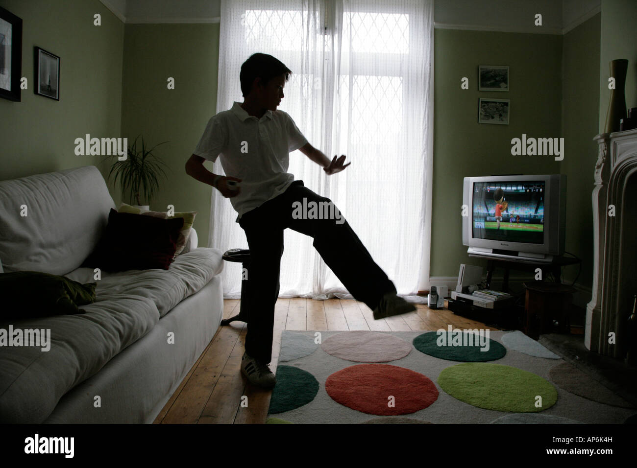 young boy playing Wii game Stock Photo