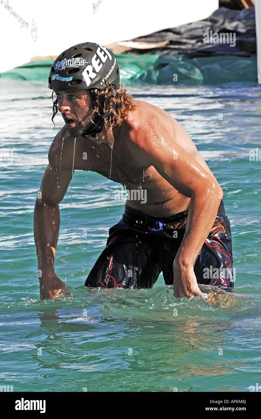 A male wearing a protective helmet whilst practicing her Wakeboard skills Stock Photo Alamy
