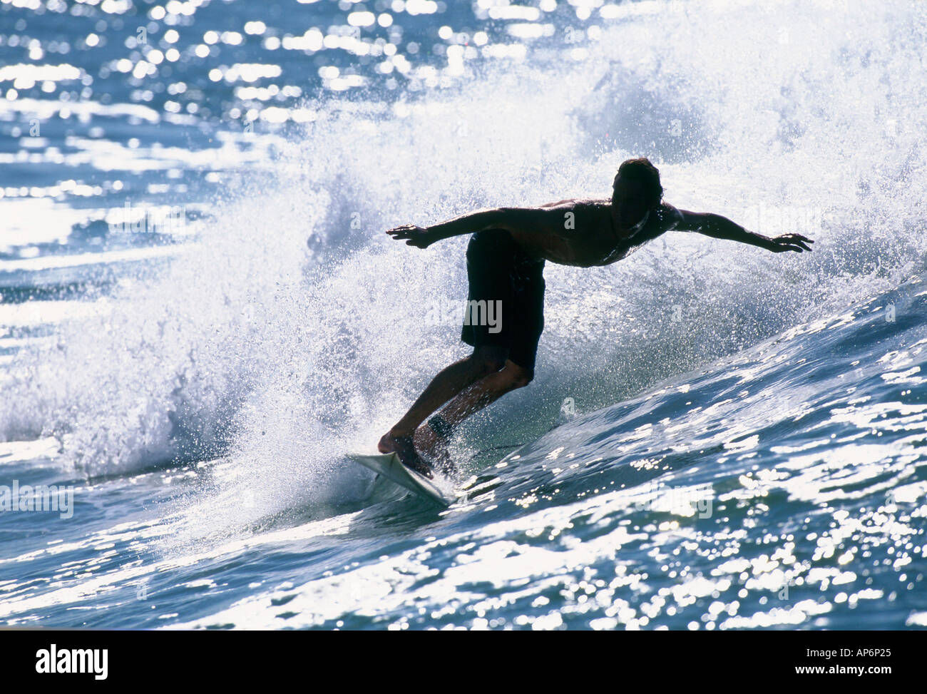 Surfer surfing on wave hi-res stock photography and images - Alamy