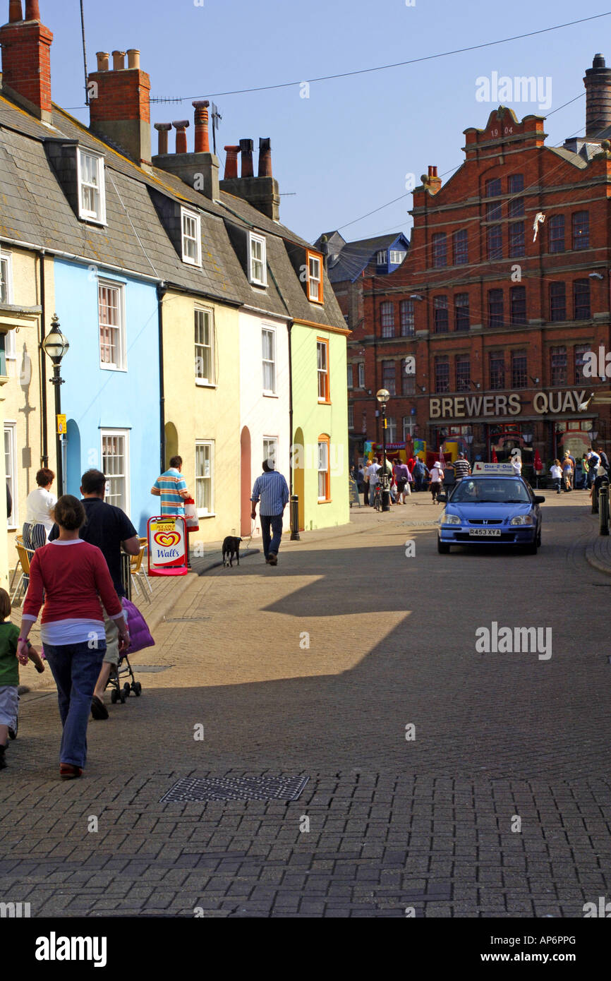 Pastel color painted houses in Brewers Quay Weymouth Dorset Stock Photo