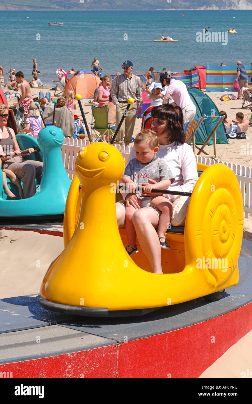 Beach fairground ride for small children at Weymouth Dorset Stock Photo ...