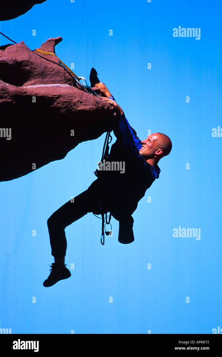 Rock climber on overhang in Fisher Towers, Colorado River Waterway near