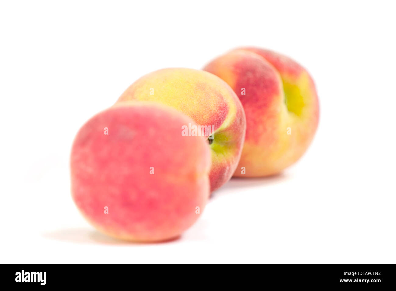 three peaches on a white background Stock Photo