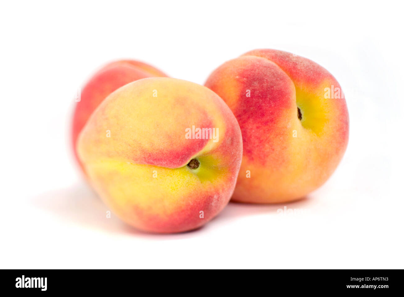 three peaches on a white background Stock Photo