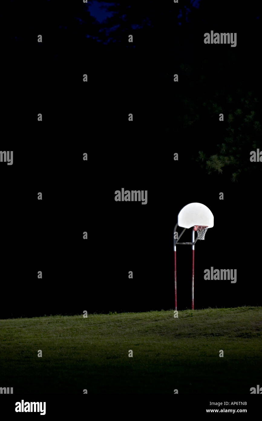 outdoor basketball goal at night Stock Photo