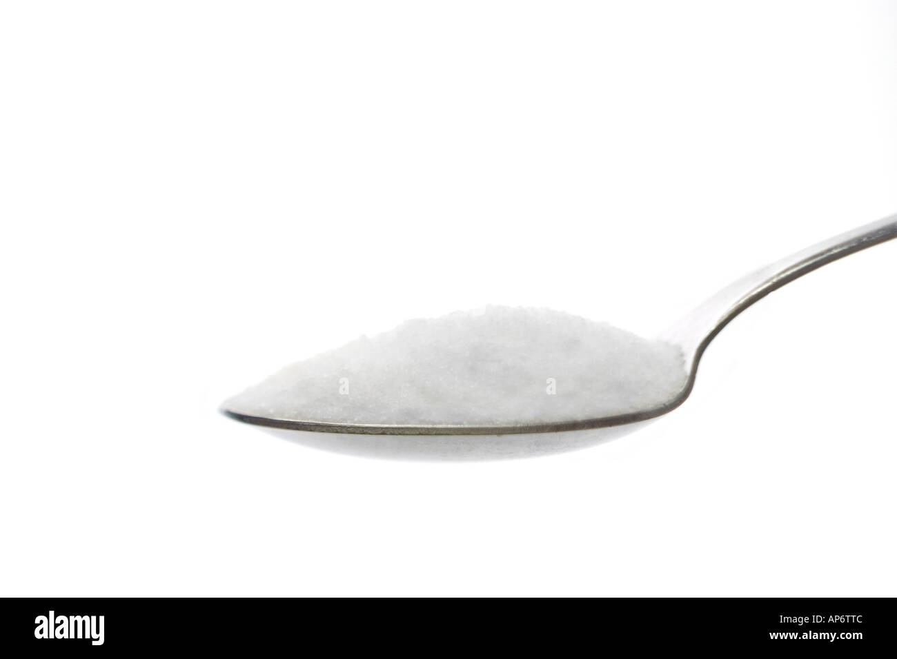 spoonful with sugar on a white background Stock Photo