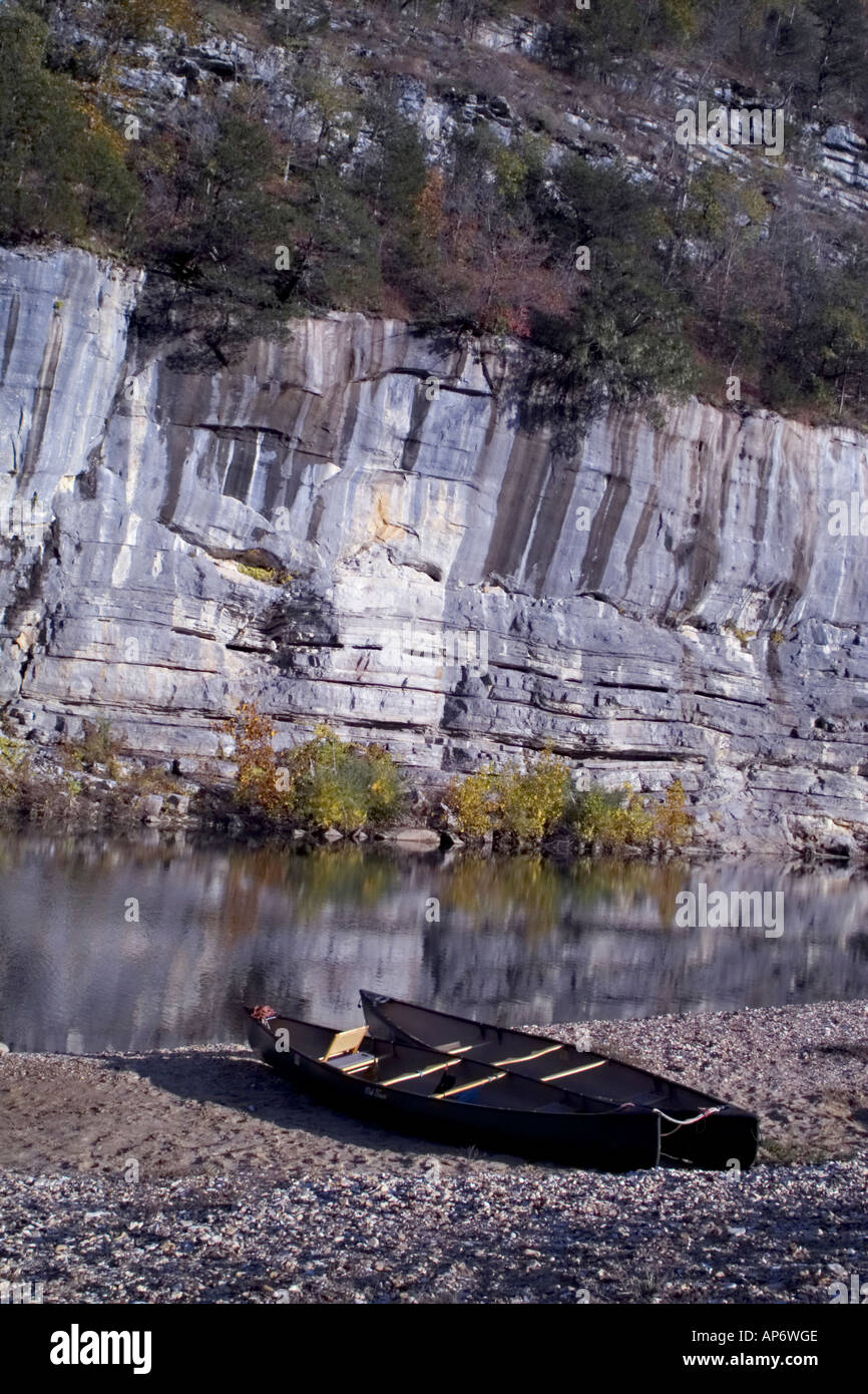 canoes beached along a riverside Stock Photo