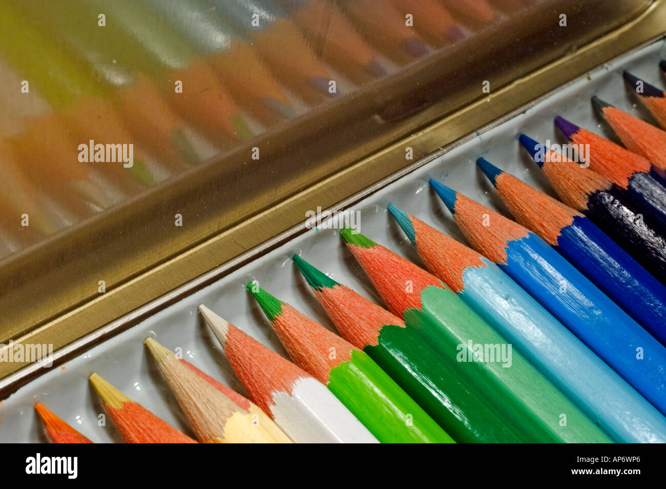 Sharpened coloured pencil crayons in their box Stock Photo
