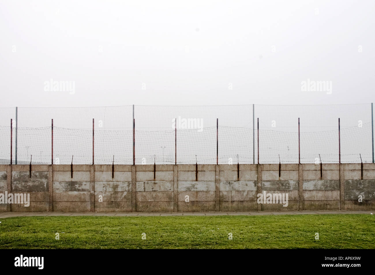 Perimeter fence around Liverpool Football Club Melwood training ground Stock Photo