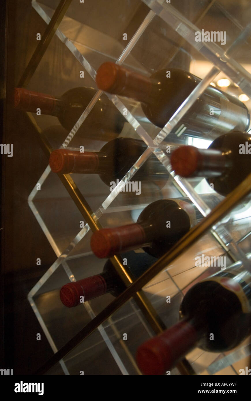 Wine bottles in a wine rack Stock Photo