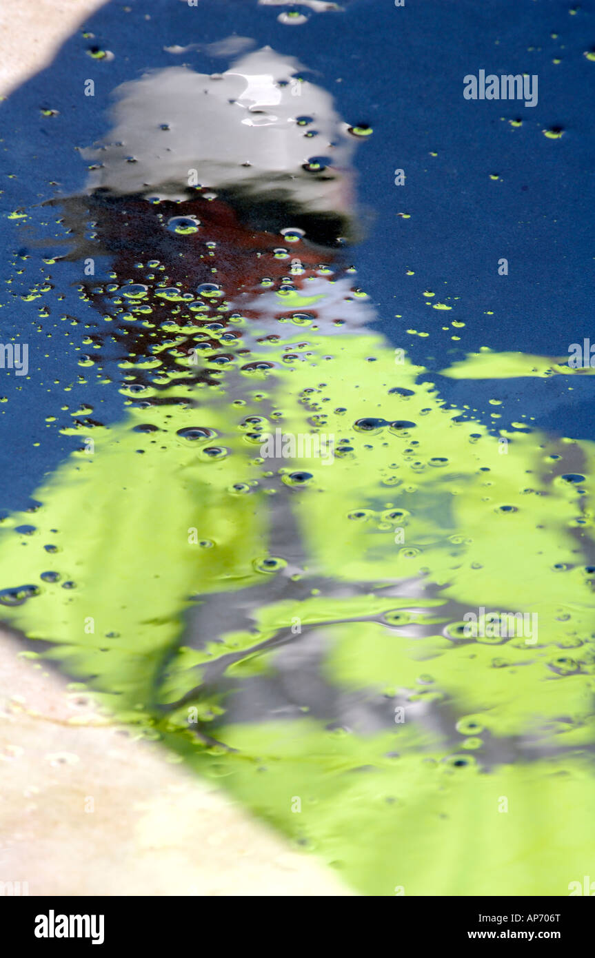 A reflection of a water or road workman wearing Ppe personal protective