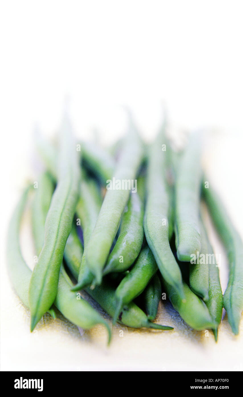 A handful of fresh green string beans on clean white background Stock ...