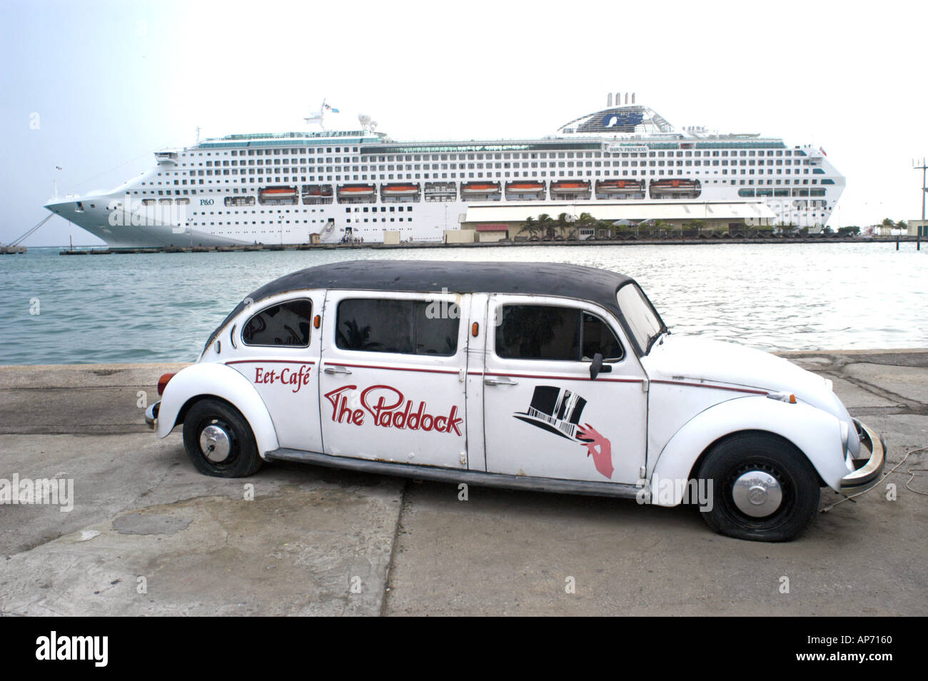Carnival Cruise ship Destiny in Aruba with long VW bus in foreground virus Stock Photo