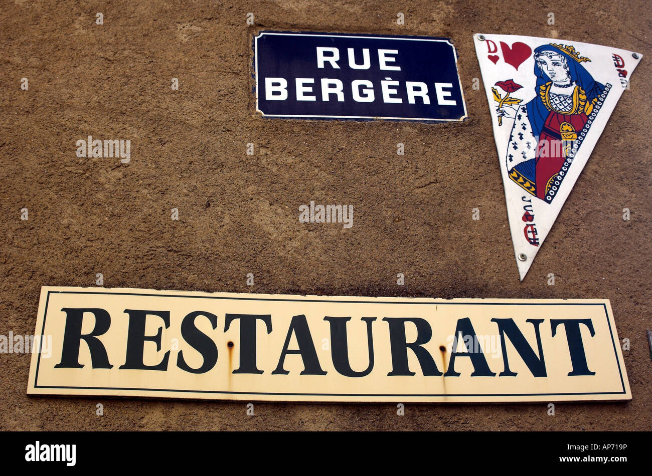 restaurant sign and street sign in South of France Stock Photo
