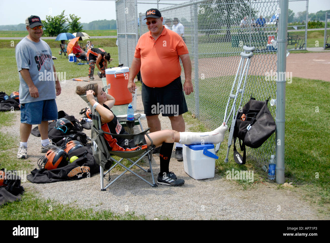 Female softball player sprains ankle from Sports injury due to playing