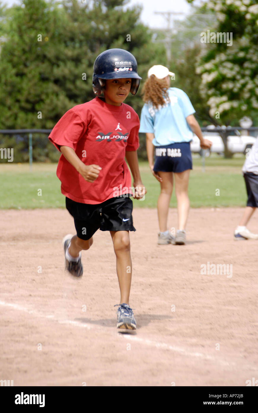 5 to 7 year old Children get their first experience playing baseball from a T Stock Photo