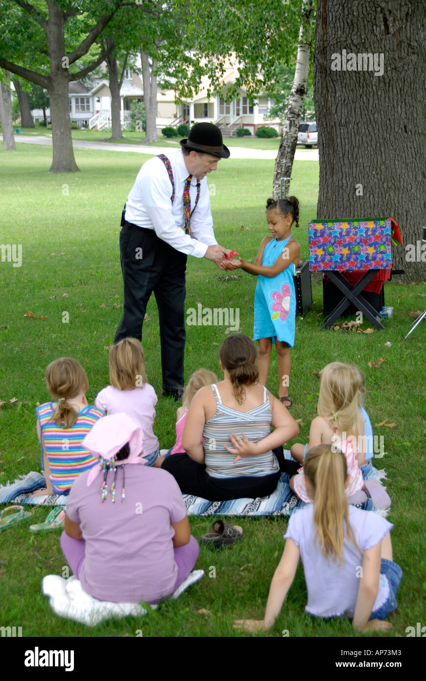 Magician performs magic tricks for children Stock Photo Alamy