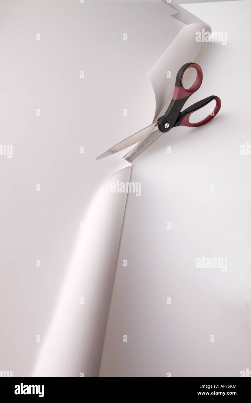 Scissors cutting paper with no hands Stock Photo Alamy