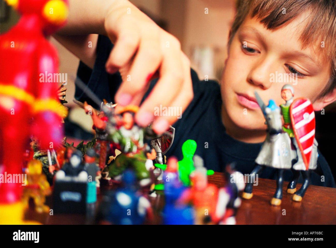 Boy Playing With Action Figures