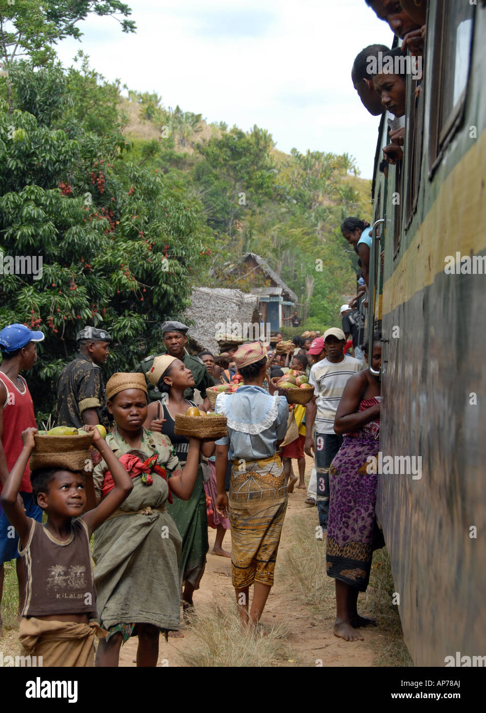 Vendors selling mainly lychees, Fianarantsoa Côte Est (FCE) railway line, Madagascar, portrait Stock Photo