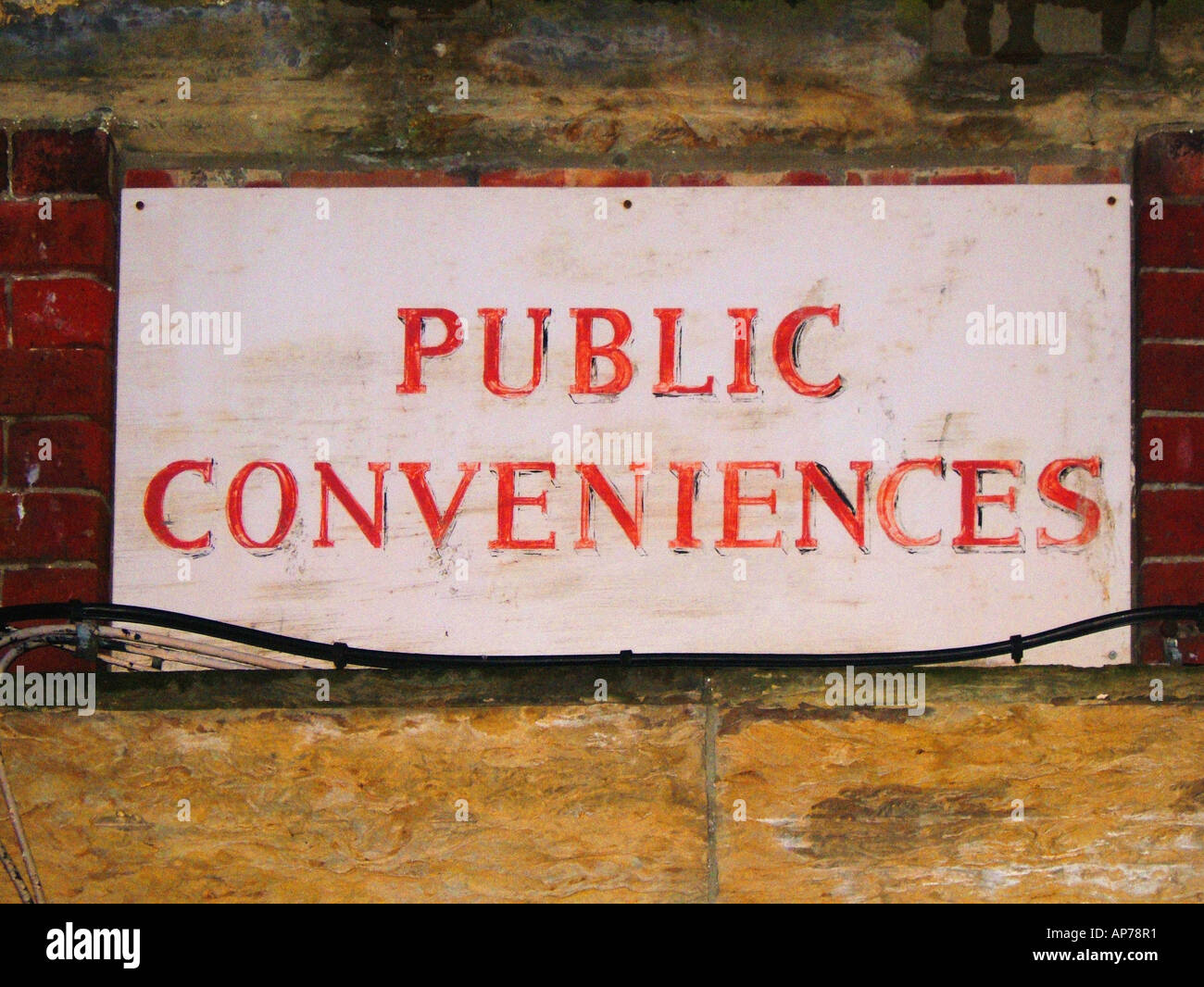 Public Conveniences sign on building Stock Photo Alamy