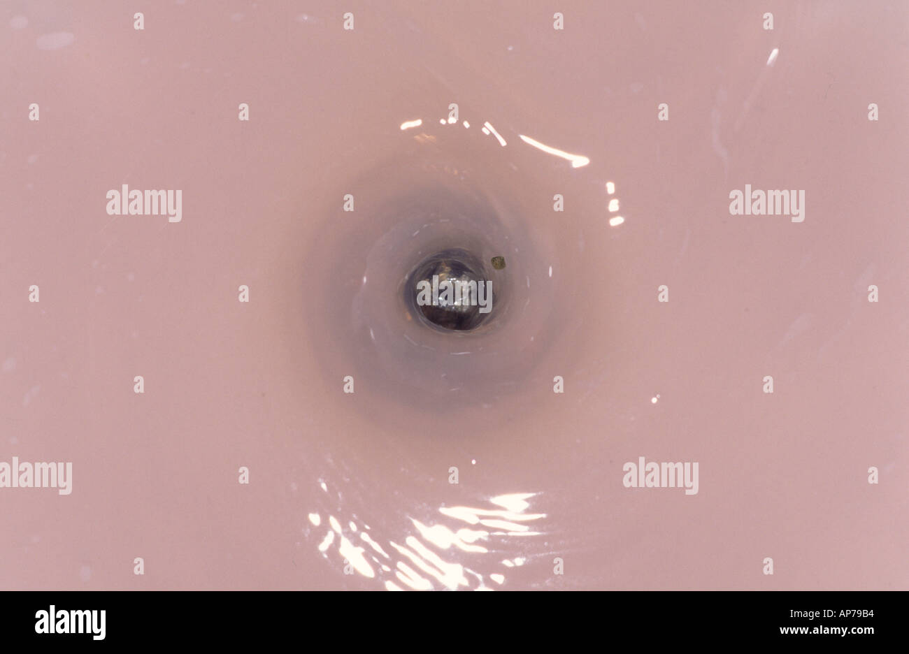 Water down the plughole Stock Photo