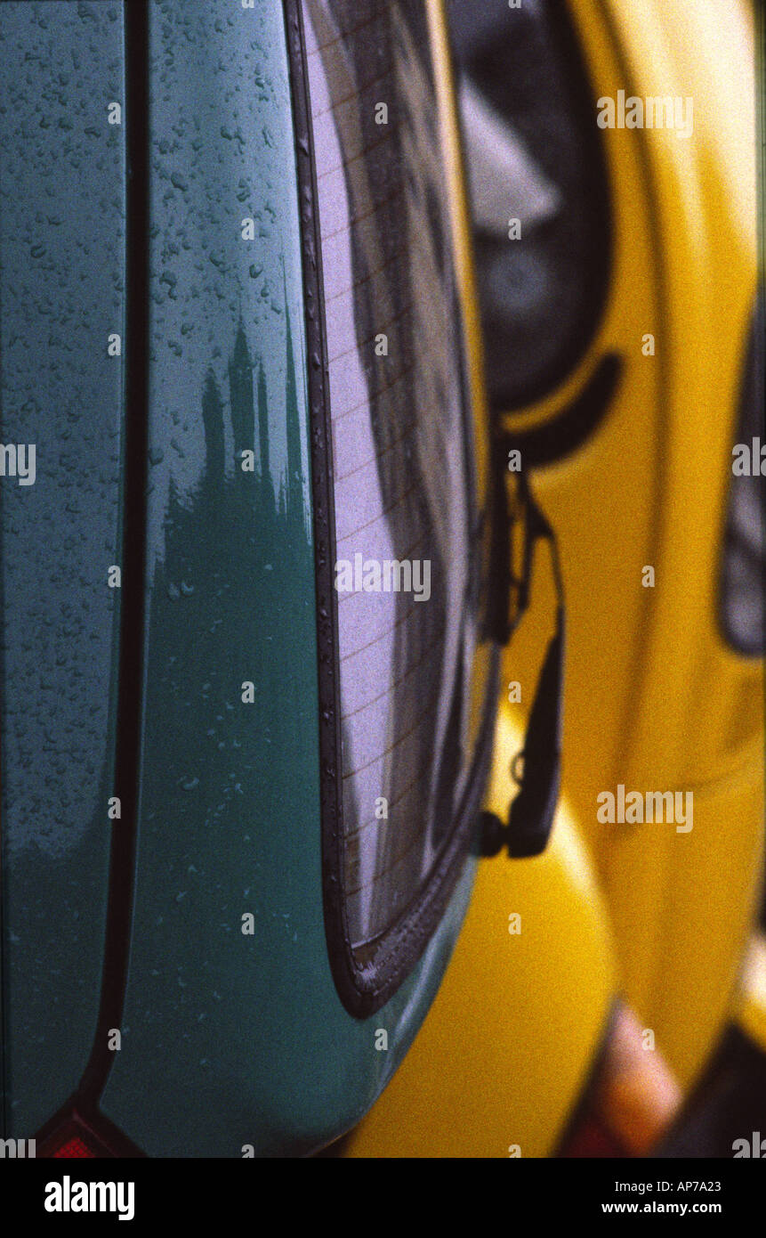 wet turquoise yellow cars Stock Photo