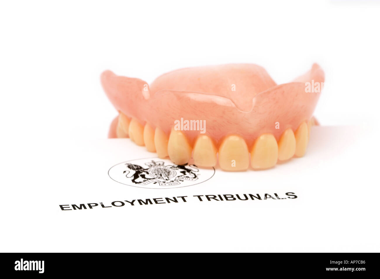 Employment Tribunal Biting off more than you can chew False Teeth  Stock Photo