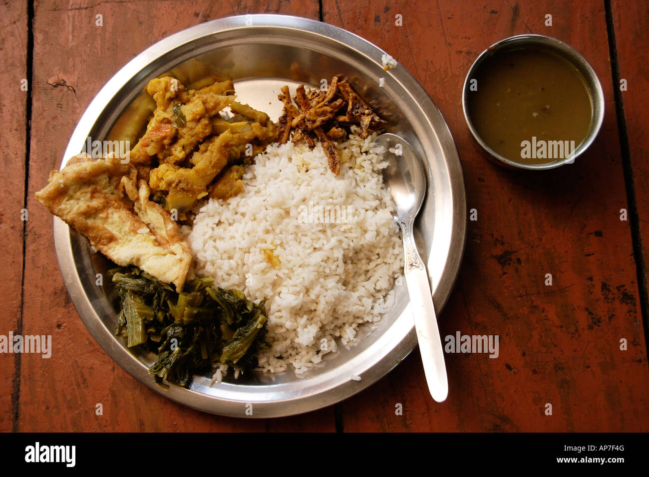 Dal bhat / vegetable thali, a Nepali/Indian dish consisting of rice, lentil soup, vegetables and here egg Stock Photo