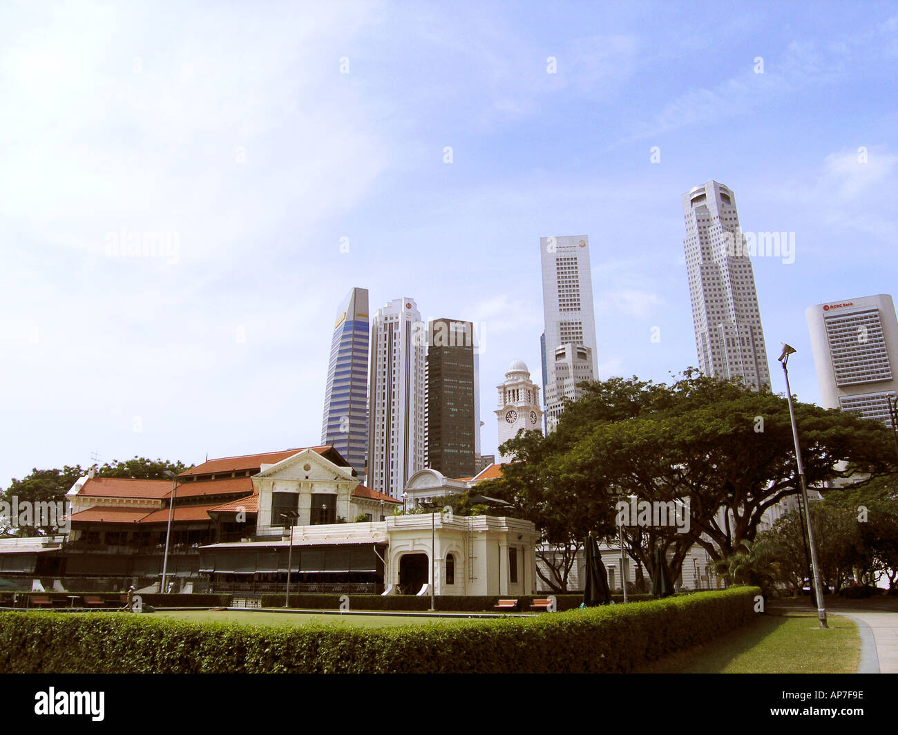 View of old colonial buildings against modern skyscrapers in Singapore Stock Photo