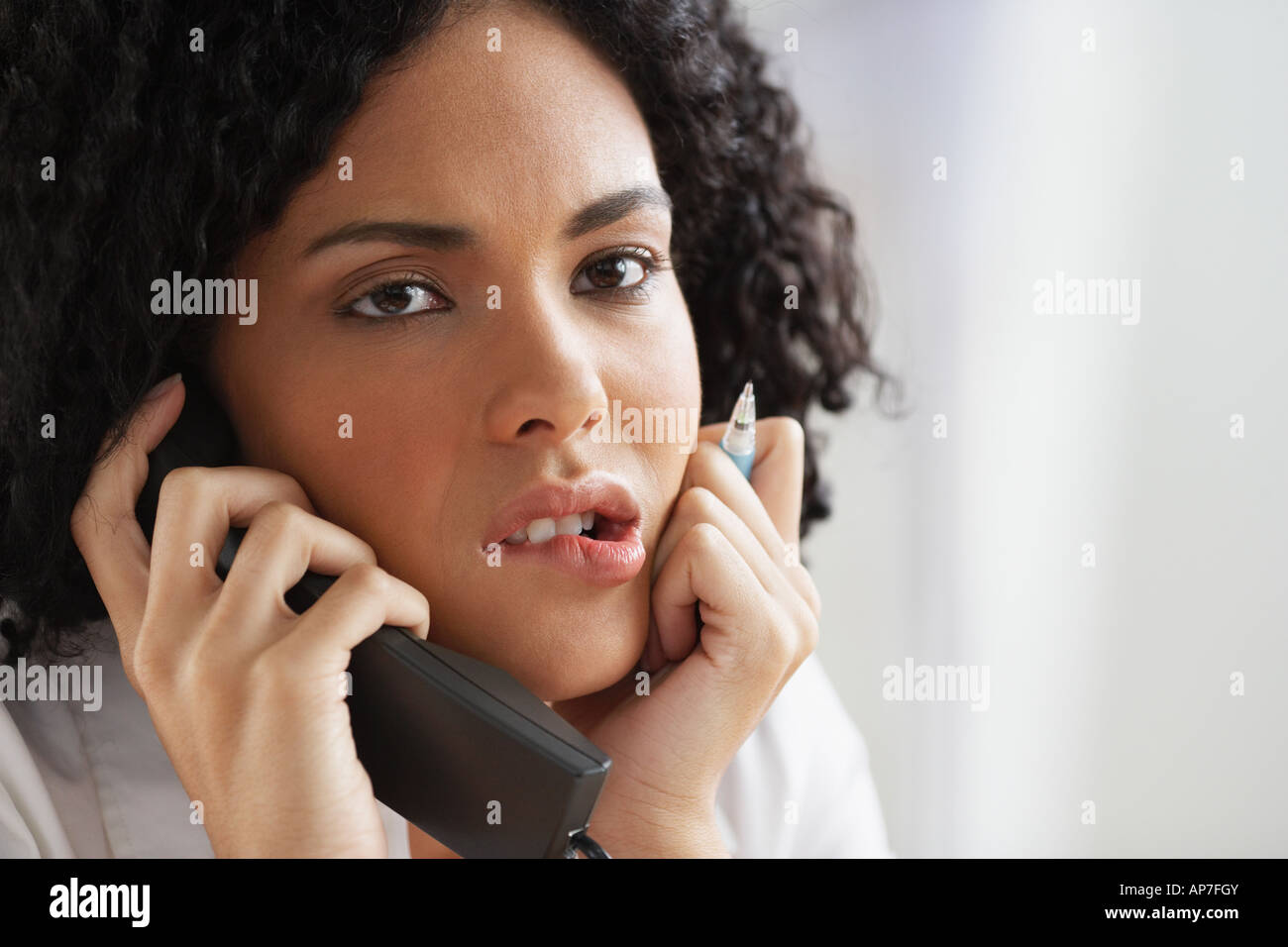 African businesswoman talking on telephone Stock Photo