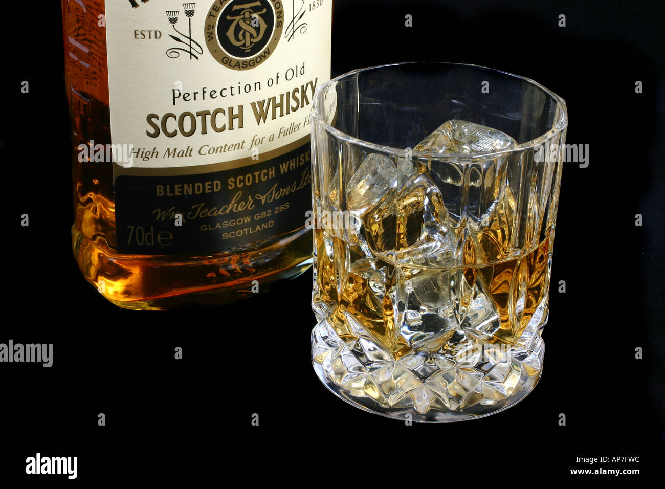 Glass of whisky with bottle Stock Photo