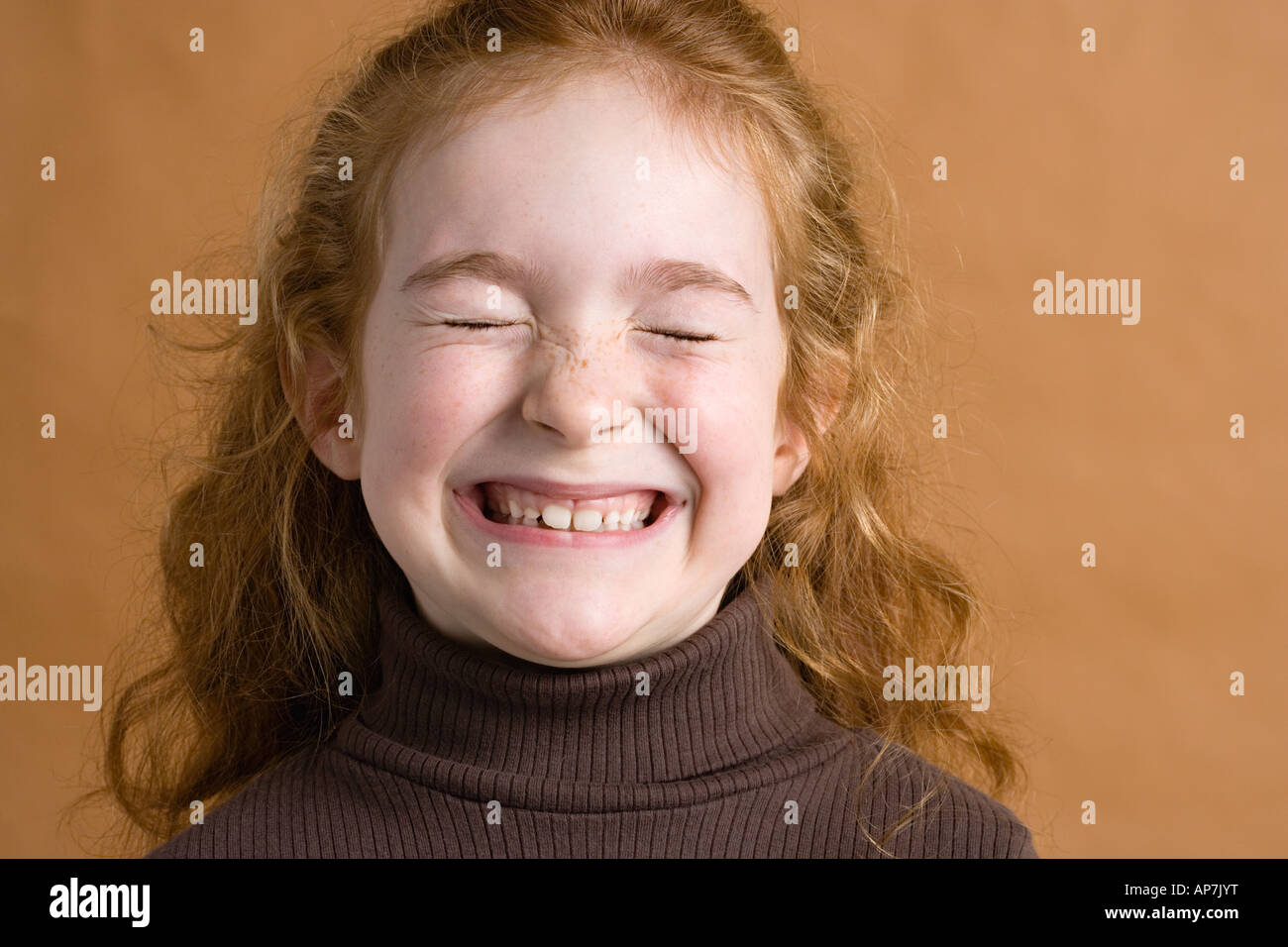 Girl smiling with eyes closed Stock Photo - Alamy