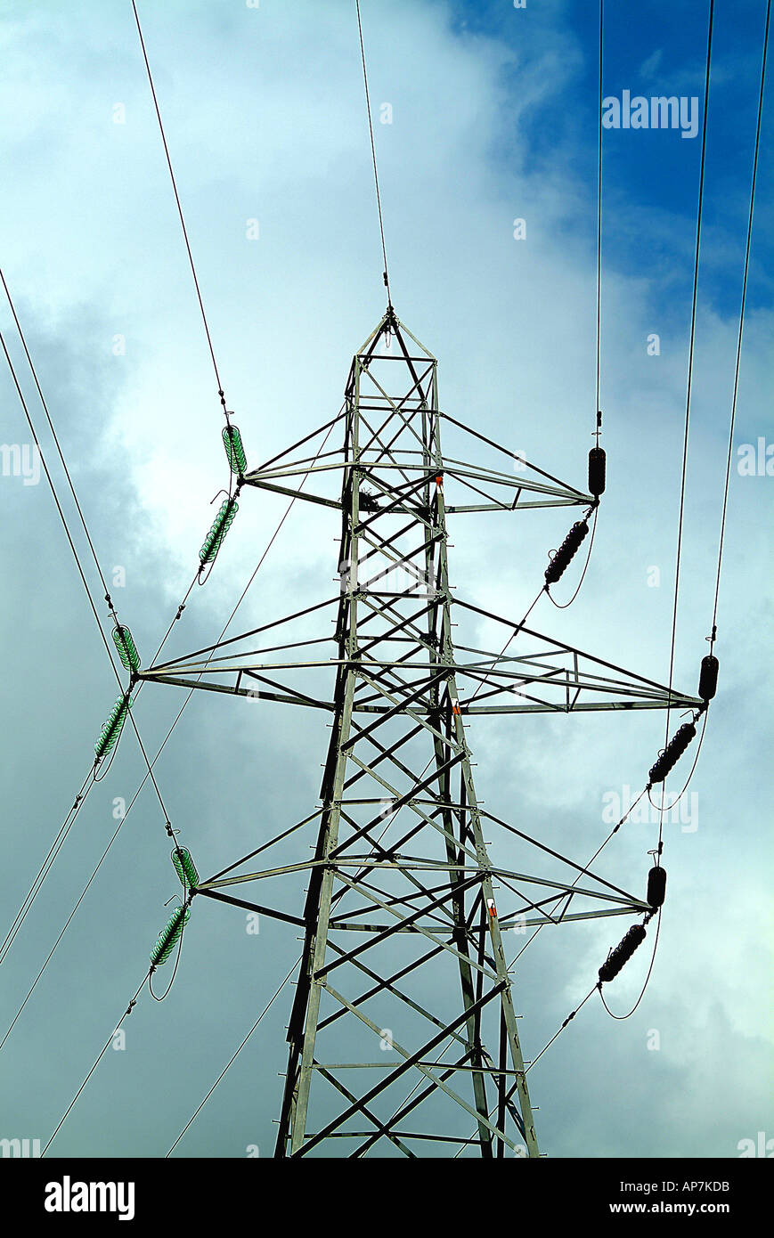 electricity pylon on a cloudy blue sky background Stock Photo - Alamy