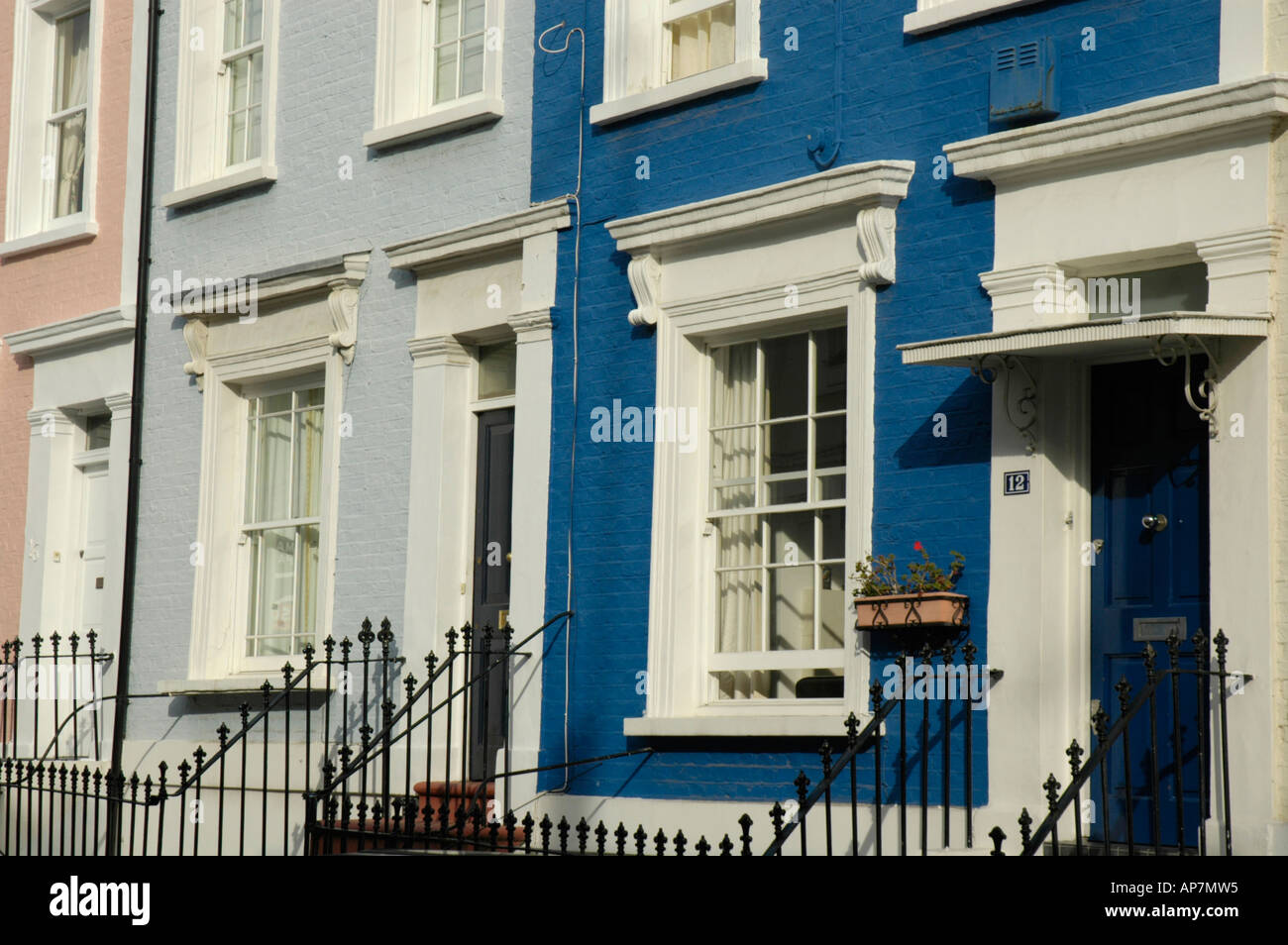 Pastel coloured painted houses in Notting Hill London England Stock